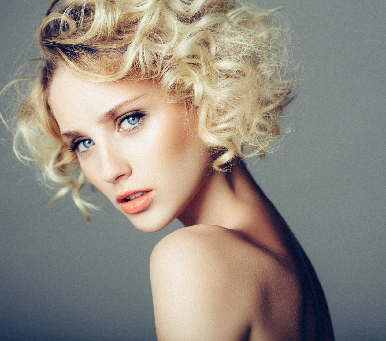 Woman with blonde curly hair